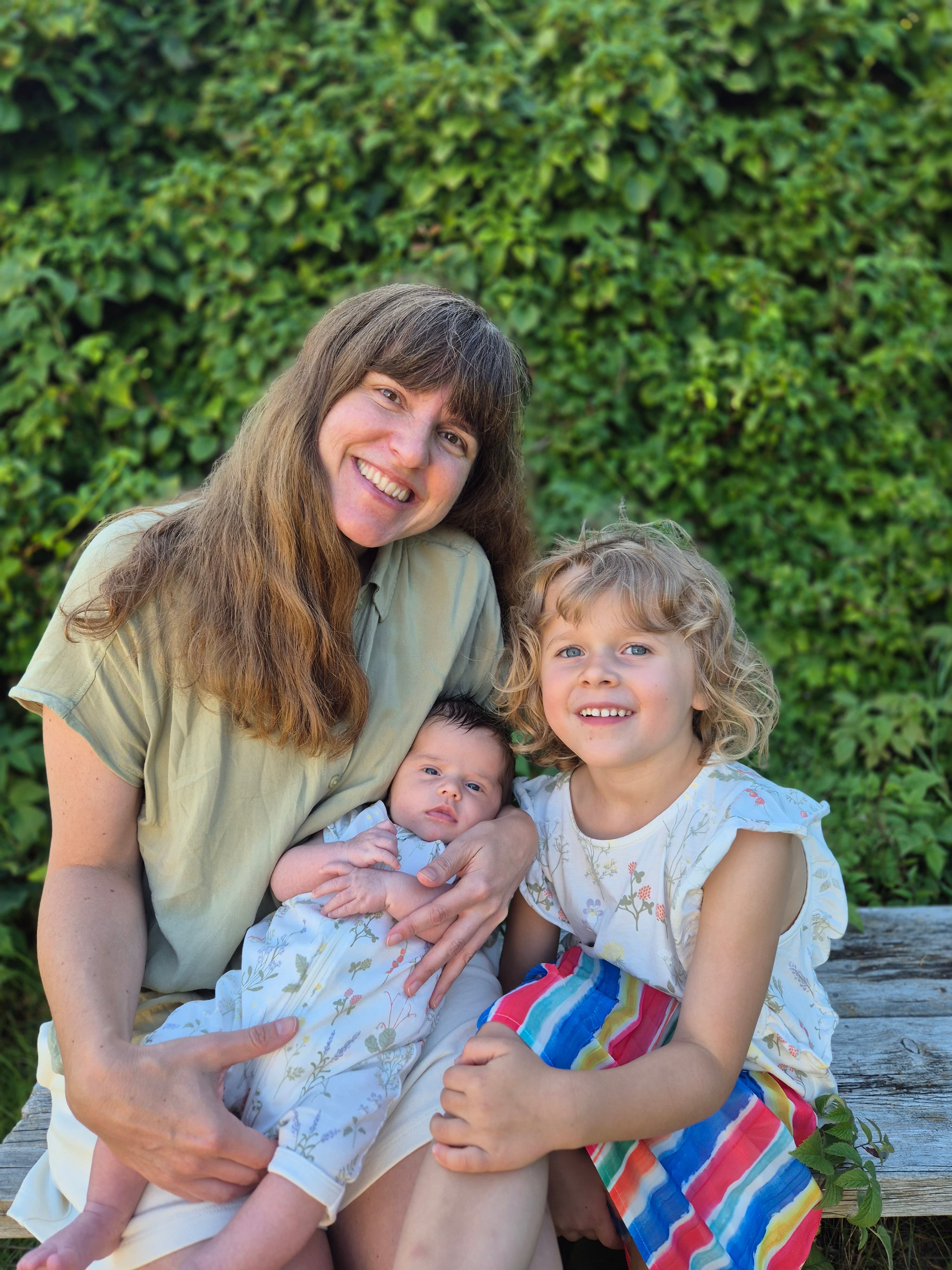 Jenny, founder of Magic Baby Books, with her two daughters